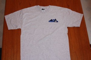 Gray T-shirt with mountain logo design.